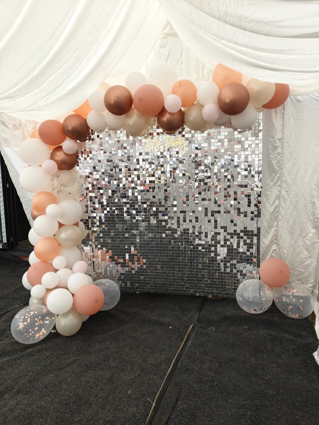 Silver shimmer wall and balloon arch hire in Essex