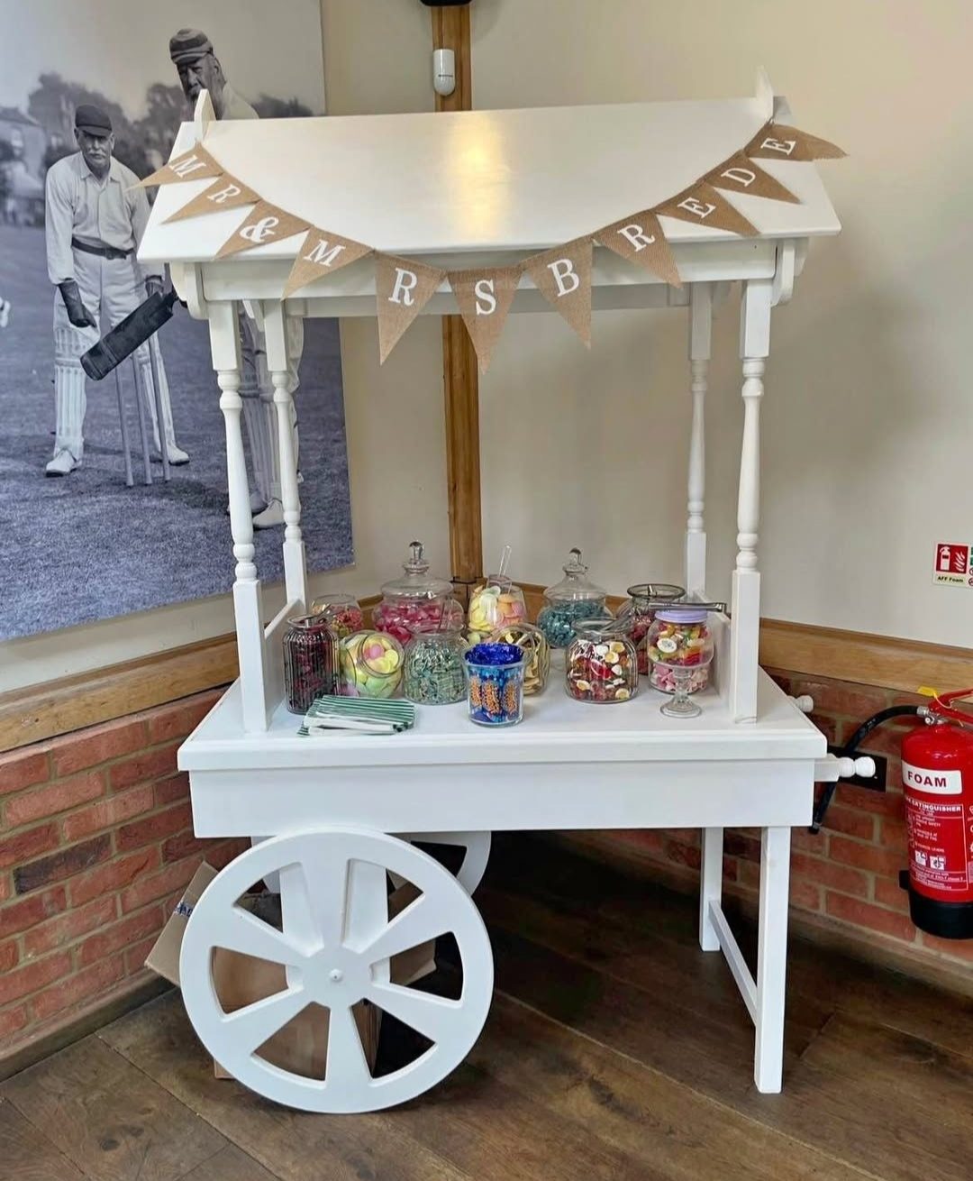 Personalised white sweet cart hire at an Essex wedding